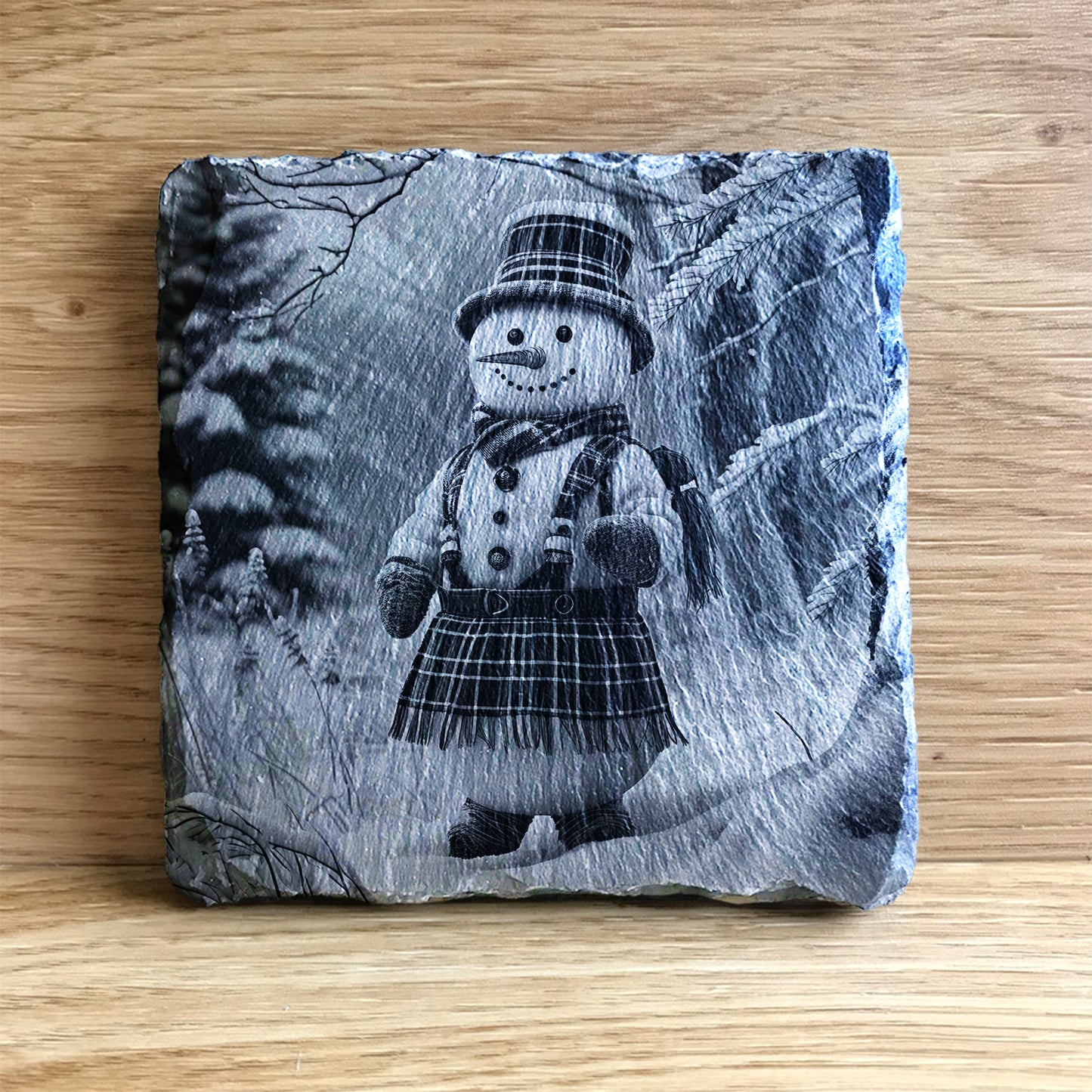 Scottish snowman at Christmas wearing a tartan kilt
