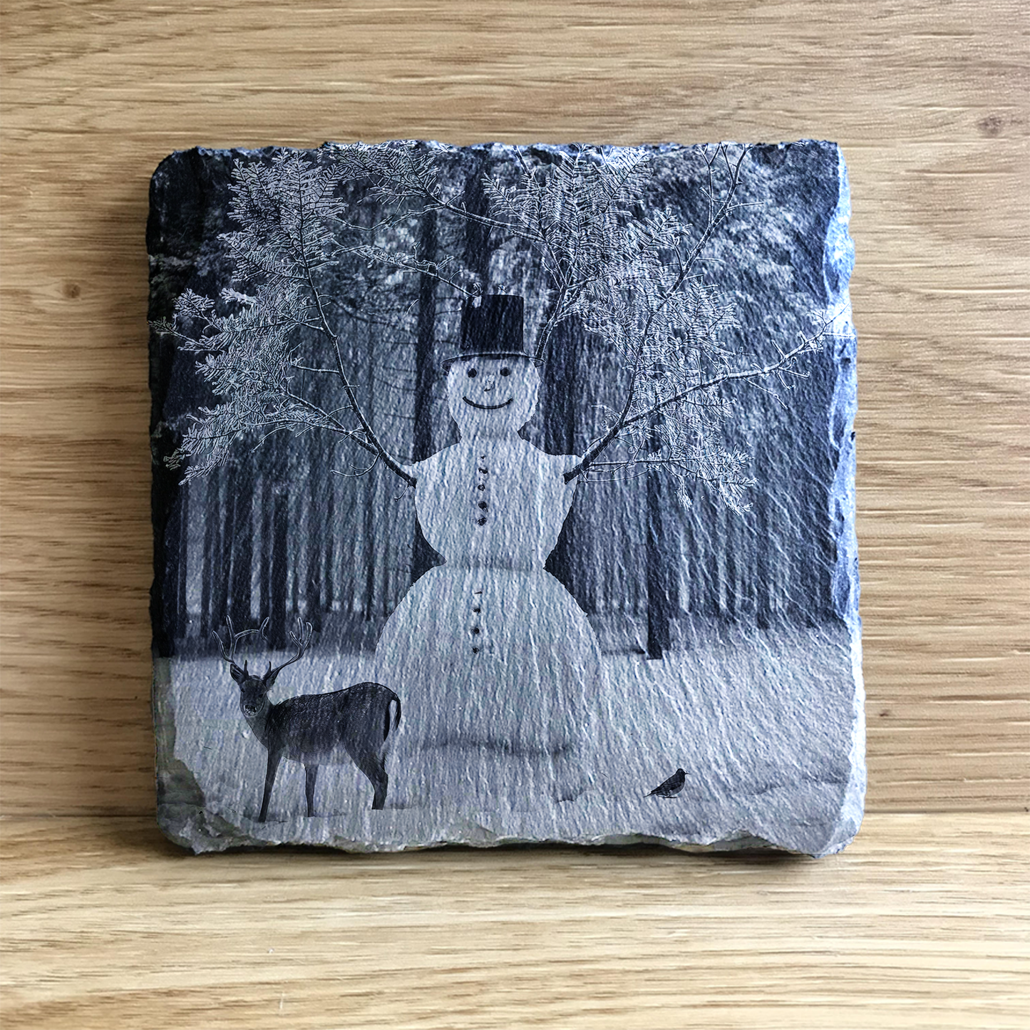 Snowman and Deer in a snowy wood at Christmas slate coaster